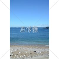 砂浜と沖に見えるボートの写真素材