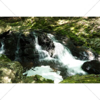 暖かい光の中流れる水流の写真素材