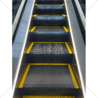 動いている上りエスカレーターの写真素材